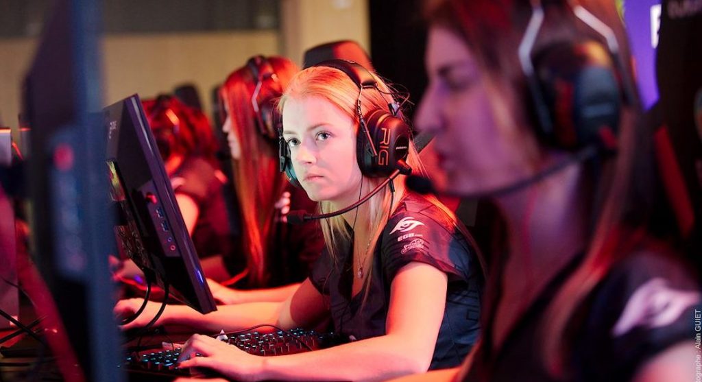 Female players of League of Legends during a match on stage at ESWC.